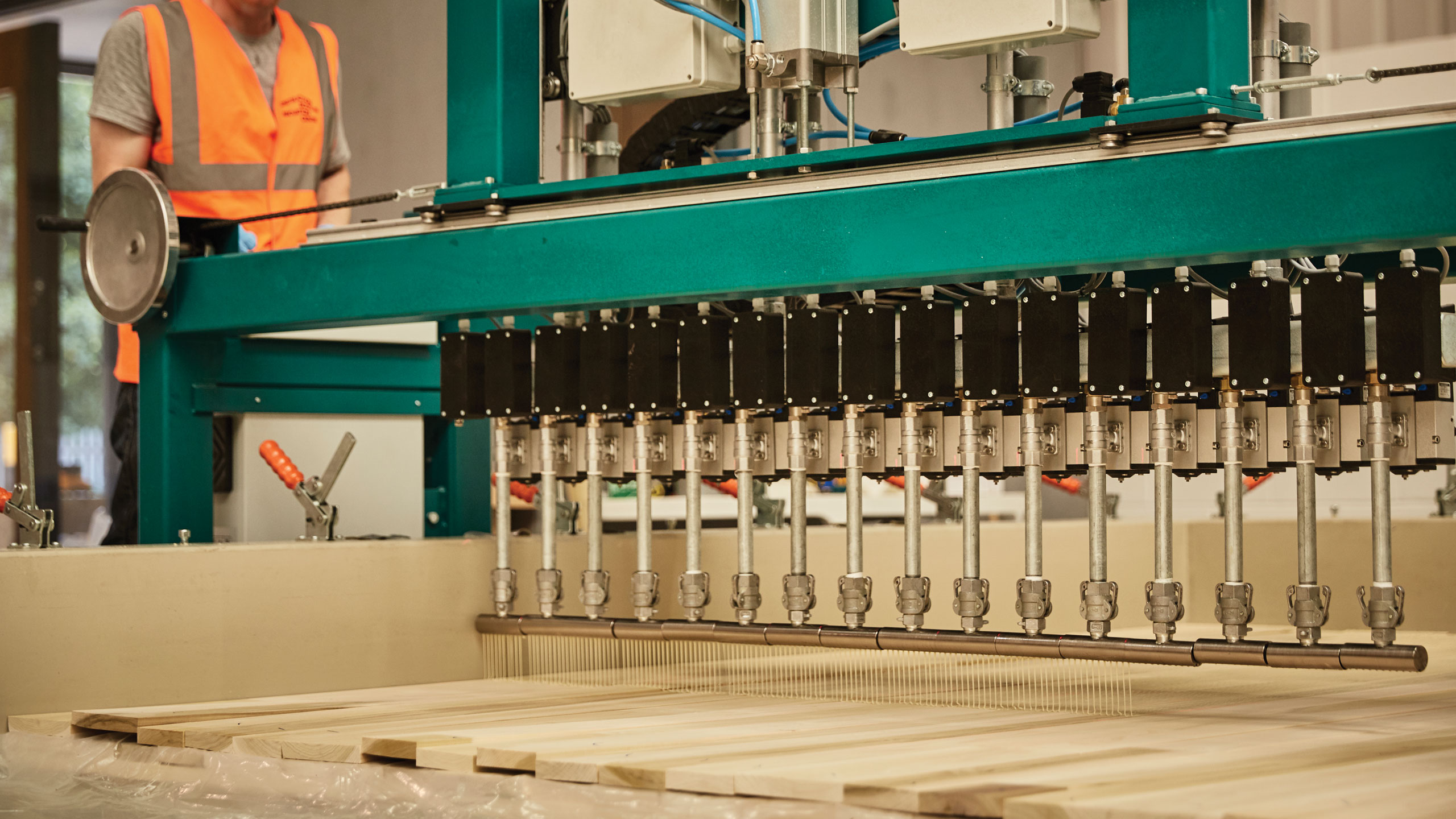 102 panels were pressed in Scotland by CSIC, making them the first UK-manufactured CLT panels.